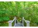 Beautiful backyard staircase, lined with greenery, leading to a scenic retreat at 17219 Grand Central Way, Cornelius, NC 28031