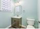 Stylish half bathroom with modern fixtures and calming blue walls at 17219 Grand Central Way, Cornelius, NC 28031