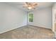 Neutral bedroom with a ceiling fan, carpet floors, and natural light at 17219 Grand Central Way, Cornelius, NC 28031