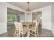Open dining room with stylish lighting and seamless transition to living spaces at 17219 Grand Central Way, Cornelius, NC 28031