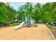 Playground featuring a slide, a play structure, with engineered wood fiber safety surfacing at 17219 Grand Central Way, Cornelius, NC 28031