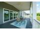 Relaxing back porch with sliding glass doors and a comfortable seating area at 175 Lone Pine Rd, Statesville, NC 28625
