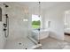 New bathroom featuring marble shower and soaking tub beneath a bright window with a green summer view at 175 Lone Pine Rd, Statesville, NC 28625