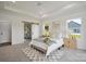 Light-filled bedroom with sliding door access to ensuite bathroom and backyard views at 175 Lone Pine Rd, Statesville, NC 28625