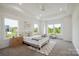 Bright, spacious bedroom with tray ceilings, large windows, and neutral decor at 175 Lone Pine Rd, Statesville, NC 28625