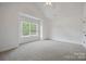 Spacious bedroom featuring carpet, a window with treed view, and a white door at 175 Lone Pine Rd, Statesville, NC 28625