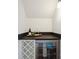 Close-up of a counter space with a wine cooler and a dark stone countertop at 175 Lone Pine Rd, Statesville, NC 28625
