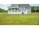 Back exterior of gray home with a spacious deck, providing a beautiful outdoor living space at 175 Lone Pine Rd, Statesville, NC 28625