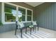 Inviting front porch with seating area featuring neutral-colored pillows and striped rug at 175 Lone Pine Rd, Statesville, NC 28625