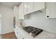 Modern kitchen featuring stainless steel appliances, sleek countertops, and white cabinets at 175 Lone Pine Rd, Statesville, NC 28625