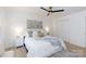Light and airy bedroom with neutral tones, a ceiling fan, and a comfortable bed with throw pillows and a quilt at 1757 Ashcroft Ln, Rock Hill, SC 29732