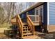 The spacious wooden deck is accessed by wooden stairs that lead to a blue house at 1757 Ashcroft Ln, Rock Hill, SC 29732
