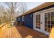 Spacious wooden deck is attached to a blue house with glass doors at 1757 Ashcroft Ln, Rock Hill, SC 29732