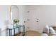 Bright entryway with console table, stylish mirror, and fresh flowers at 1757 Ashcroft Ln, Rock Hill, SC 29732