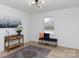 Stylized living room featuring an area rug, a console table with decorative items, and a window with an outdoor view at 1757 Ashcroft Ln, Rock Hill, SC 29732