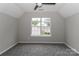 This bedroom features neutral walls, gray carpet, and a window at 183 Bellelaine Dr, Mooresville, NC 28115