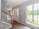Bright entryway with hardwood floors, a staircase, and a large window at 183 Bellelaine Dr, Mooresville, NC 28115