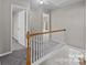 The carpeted second floor hallway features natural light at 183 Bellelaine Dr, Mooresville, NC 28115