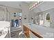 The main bathroom boasts a large vanity and a walk-in shower with a glass door at 183 Bellelaine Dr, Mooresville, NC 28115