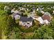 An aerial shot of a well-maintained property in a green and leafy neighborhood at 1900 Birchbrook Ct, Harrisburg, NC 28075