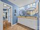 Bright bathroom featuring dual vanities, custom cabinets, and modern fixtures for a luxurious feel at 1900 Birchbrook Ct, Harrisburg, NC 28075