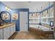 The main bathroom has a soaking tub, and walk-in shower with lots of natural light at 1900 Birchbrook Ct, Harrisburg, NC 28075