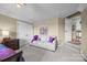 Bedroom showcasing a sofa, closet, and decor with a view towards the doorway at 1900 Birchbrook Ct, Harrisburg, NC 28075