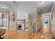 Bright upstairs hallway showcases beautiful floors and decorative details and leads to the bedrooms at 1900 Birchbrook Ct, Harrisburg, NC 28075