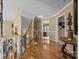 Open upstairs hallway has hardwood floors and decorative details, creating an inviting transition to the bedrooms at 1900 Birchbrook Ct, Harrisburg, NC 28075