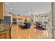 This kitchen features an island with bar seating, stainless steel appliances, and a cozy breakfast nook at 1900 Birchbrook Ct, Harrisburg, NC 28075