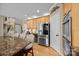 This kitchen features stainless steel appliances, a breakfast bar and custom cabinets and tons of storage at 1900 Birchbrook Ct, Harrisburg, NC 28075