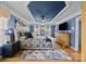 The main bedroom has a trey ceiling, a ceiling fan and plenty of natural light at 1900 Birchbrook Ct, Harrisburg, NC 28075