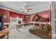 Spacious home office with a desk, chaise lounge, and natural light creating a comfortable workspace at 1900 Birchbrook Ct, Harrisburg, NC 28075