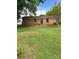 Backyard with a brick home, lawn, and patio at 2030 Keisler Dairy Rd, Conover, NC 28613