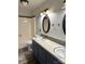 Updated bathroom featuring double sinks, updated vanity, and tub with decorative tile at 2030 Keisler Dairy Rd, Conover, NC 28613