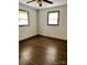 Bedroom with hardwood floors, neutral paint, and dual windows for natural light at 2030 Keisler Dairy Rd, Conover, NC 28613