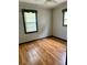Bedroom featuring hardwood floors, neutral walls, and natural light from two windows at 2030 Keisler Dairy Rd, Conover, NC 28613