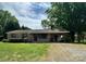 Charming brick ranch-style home featuring a covered carport and well-maintained landscaping at 2030 Keisler Dairy Rd, Conover, NC 28613
