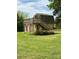 Two-story building with a deck and stairs leading to the second floor, surrounded by a green lawn at 2030 Keisler Dairy Rd, Conover, NC 28613