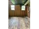 Interior showcasing exposed wood framing, with windows and flooring detail at 2030 Keisler Dairy Rd, Conover, NC 28613