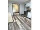 Renovated kitchen with new flooring, stainless steel appliances and blue trim at 2030 Keisler Dairy Rd, Conover, NC 28613