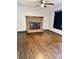 Cozy living room with brick fireplace, hardwood floors, and ample natural light at 2030 Keisler Dairy Rd, Conover, NC 28613