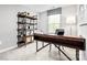 Bright home office featuring a wooden desk, shelving unit, and a window with natural light at 2049 Stephens Farm Dr, China Grove, NC 28023