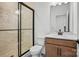 Modern bathroom with a glass-enclosed shower, wood vanity, and neutral tiling at 2176 Millennium Dr # 093, Lancaster, SC 29720