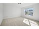 Carpeted bedroom featuring one bright window, white trim, and neutral paint at 2176 Millennium Dr # 093, Lancaster, SC 29720