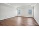Spacious bedroom with tray ceilings, hardwood floors, recessed lighting, and two windows for ample natural light at 2176 Millennium Dr # 093, Lancaster, SC 29720