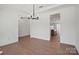 Dining room boasts hardwood floors, white walls, chandelier, and an open view to the kitchen, creating a modern feel at 2176 Millennium Dr # 093, Lancaster, SC 29720