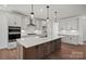 Modern kitchen with large center island, stainless appliances, and plenty of cabinet space, perfect for culinary enthusiasts at 2176 Millennium Dr # 093, Lancaster, SC 29720
