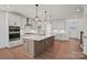 Bright kitchen showcases a spacious island, stainless steel appliances, and ample storage in modern, white cabinetry at 2176 Millennium Dr # 093, Lancaster, SC 29720