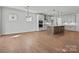 Open-concept kitchen with white cabinetry, a large island, and stainless steel appliances at 2176 Millennium Dr # 093, Lancaster, SC 29720